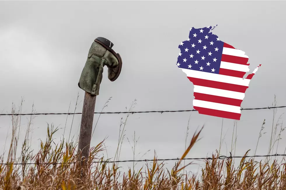 Exploring The Symbolic Meaning Of Cowboy Boots On Fences In Wisconsin